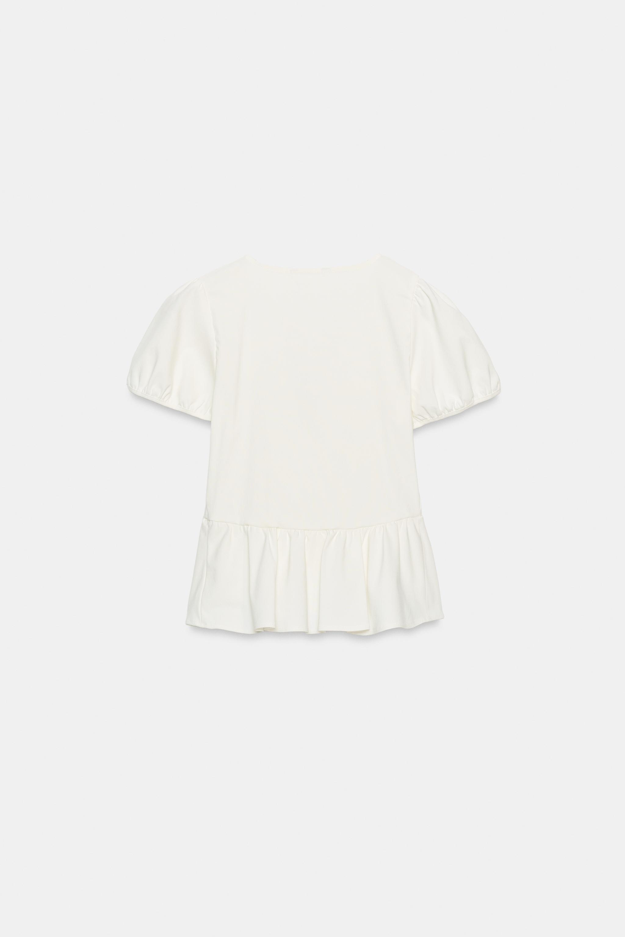 TOP PÉPLUM À BOUTONS DORÉS